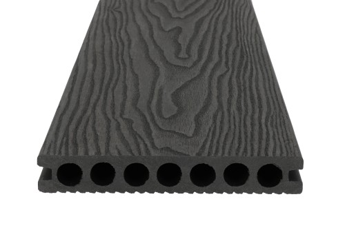 Dark grey composite decking board – cross-section with round hollow chambers and a wood texture.