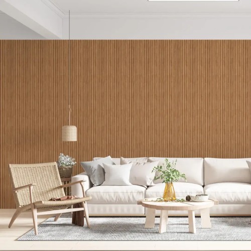 Oak fluted panels on the wall of a bright living room with a white sofa, coffee table and woven armchair.