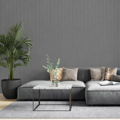 A grooved grey panel on the wall behind a grey sofa in a modern living room.