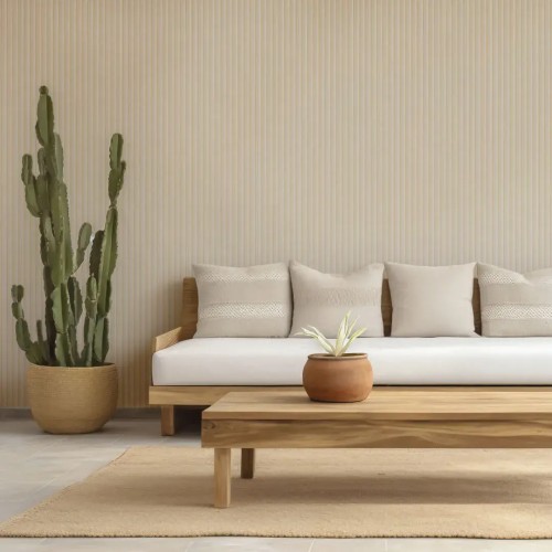 Beige fluted panel on the wall of a bright living room with a wooden sofa, low table and potted cactus.