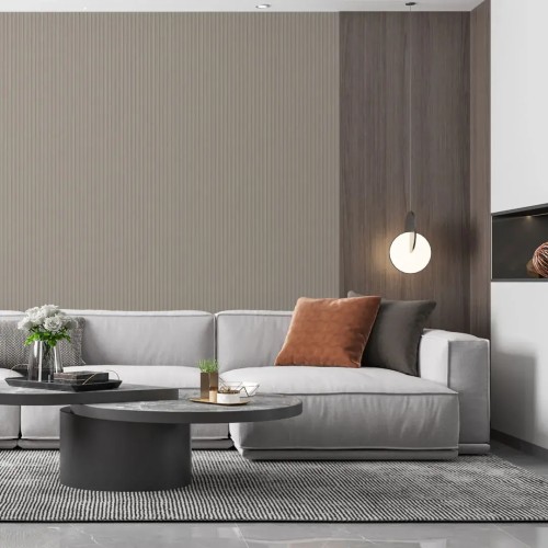 Vertical fluted panel in cashmere colour on the wall behind a light-coloured sofa in a modern living room.