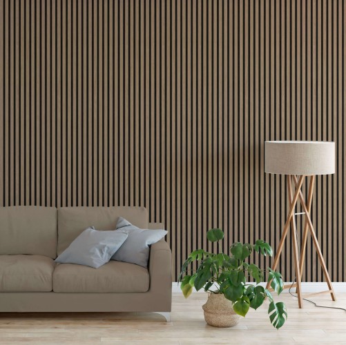 Vertical American walnut acoustic slats on the wall of a modern living room with a sofa and lamp.