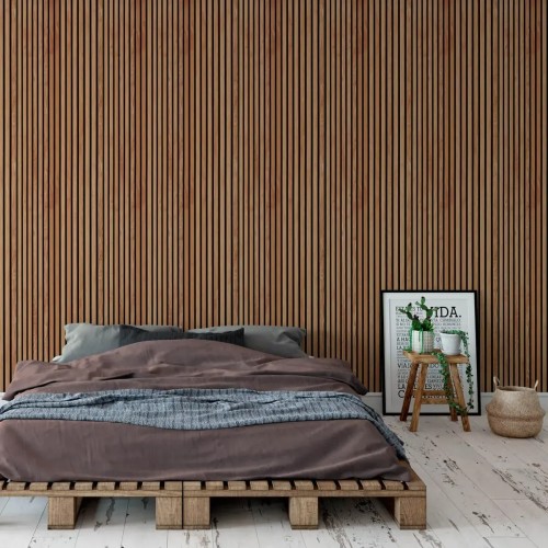 Sapelli-coloured wooden acoustic slats on the wall behind a low bed in a modern bedroom.