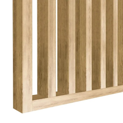 Detail of the bottom edge of a screen made from vertical natural oak-coloured slats.