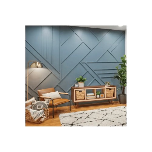 A blue wall decorated with a geometric pattern of DIY wall slats in a modern living room.