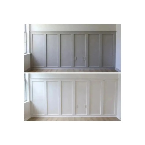 Wall with decorative frames made from wall mouldings, painted grey and white.