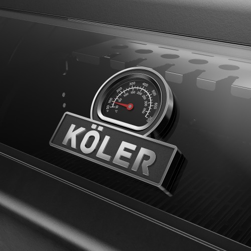 A dial thermometer and KÖLER logo on the glass lid of a black gas barbecue.