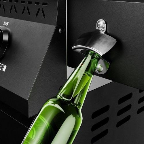 Green glass bottle in a metal bottle opener fitted to a black gas barbecue.