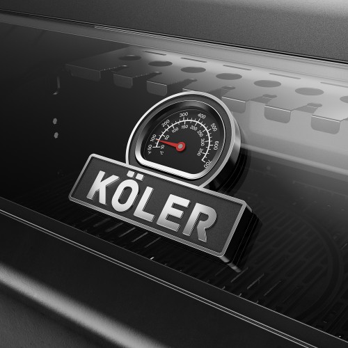A thermometer and KÖLER logo on the glass lid of a black gas barbecue.