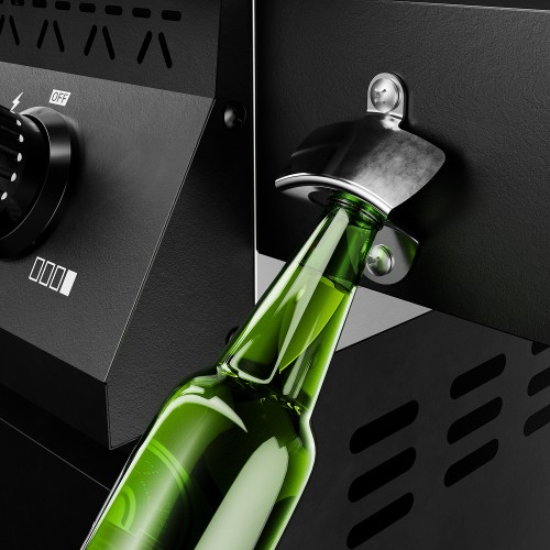 Green bottle in a metal opener attached to the black casing of a gas barbecue.