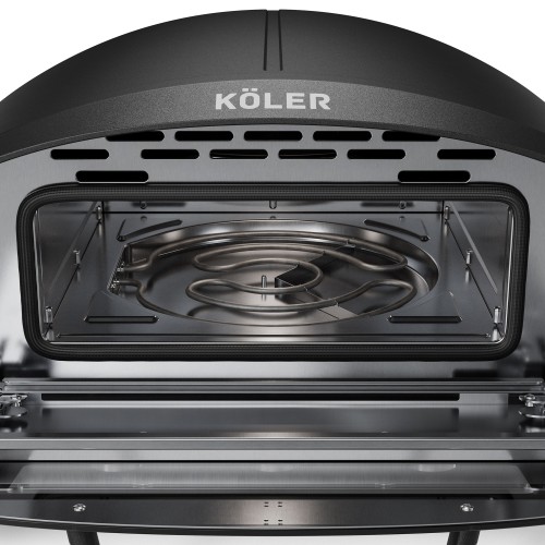 Interior of an open KÖLER pizza oven, with the electric heating element visible on the floor of the chamber.