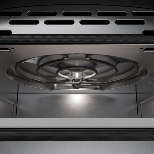 Inside a pizza oven chamber, showing a circular electric heating element and spot lighting in the ceiling.