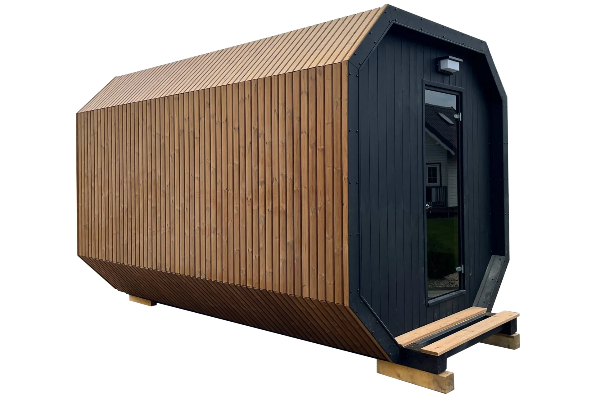 A modern Finnish garden sauna finished with wooden slats and a black front with glazed doors.